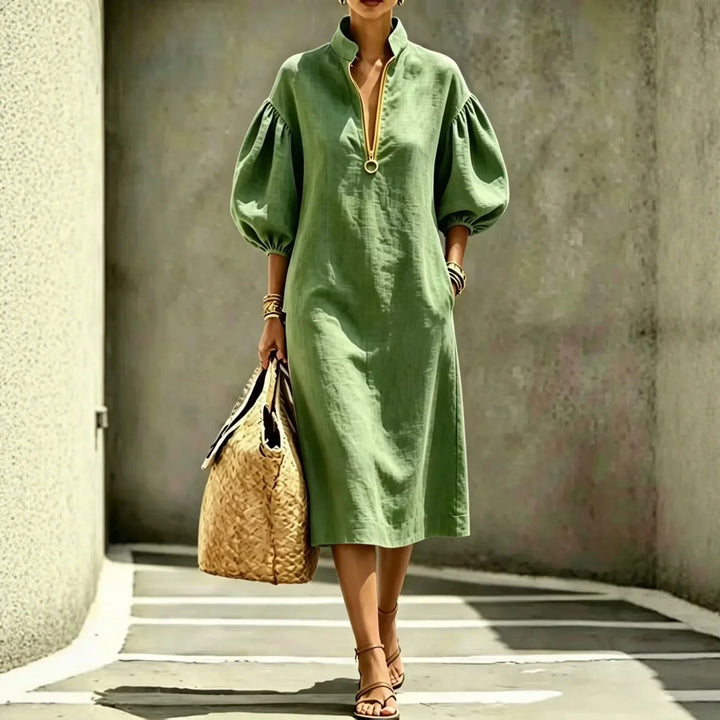 Stylish women's half-zip midi dress, perfect for casual chic looks. Features comfortable fabric and bubble sleeves.