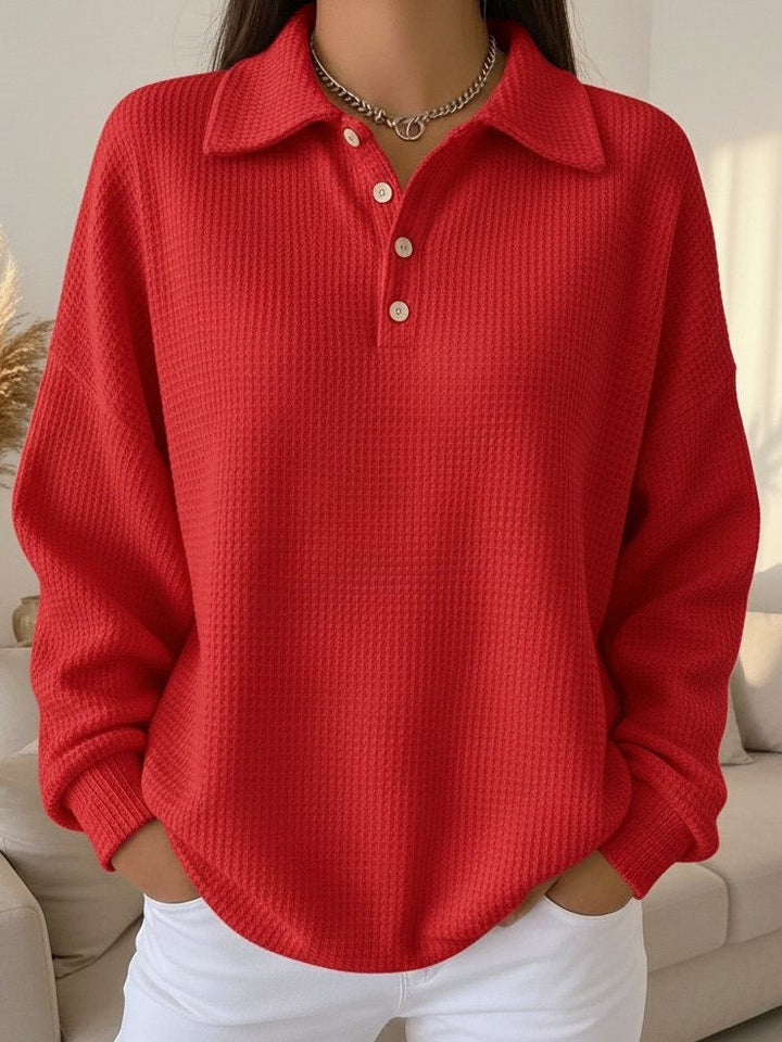 Oversized Henley pullover for women, a cozy & relaxed fit for versatile autumn fashion.