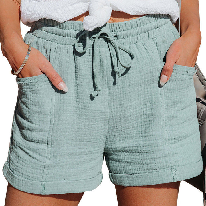 Ultra-comfortable women's cotton shorts with elastic drawstring waist & pockets for summer relaxation.