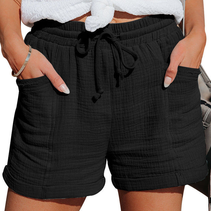 Versatile women's cotton shorts with pockets & drawstring, ideal for everyday casual summer wear.