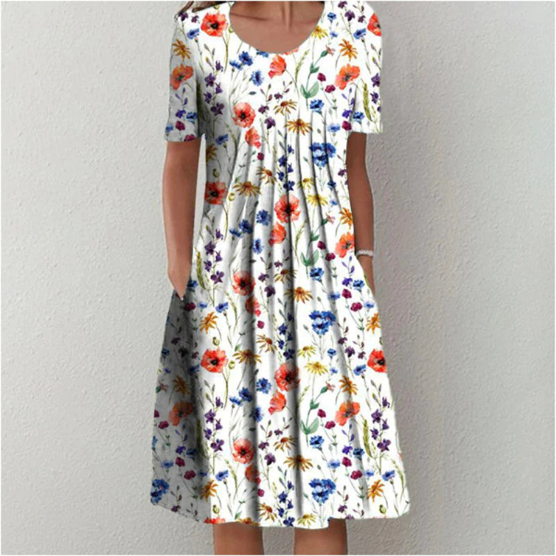 Women's casual floral A-line midi dress with short sleeves & practical pockets, perfect for summer everyday wear.