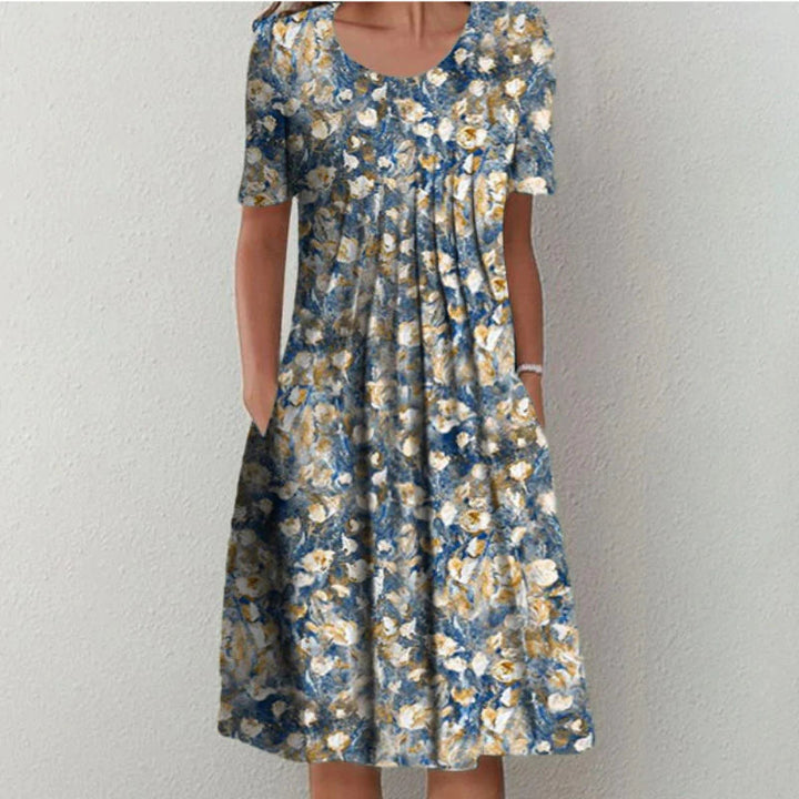 Stylish women's midi floral dress featuring short sleeves and convenient pockets for a chic casual look.
