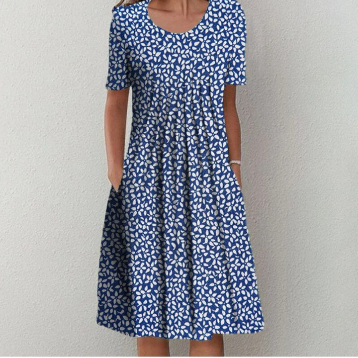 Everyday A-line floral midi dress for women, with short sleeves & pockets, designed for casual summer comfort.