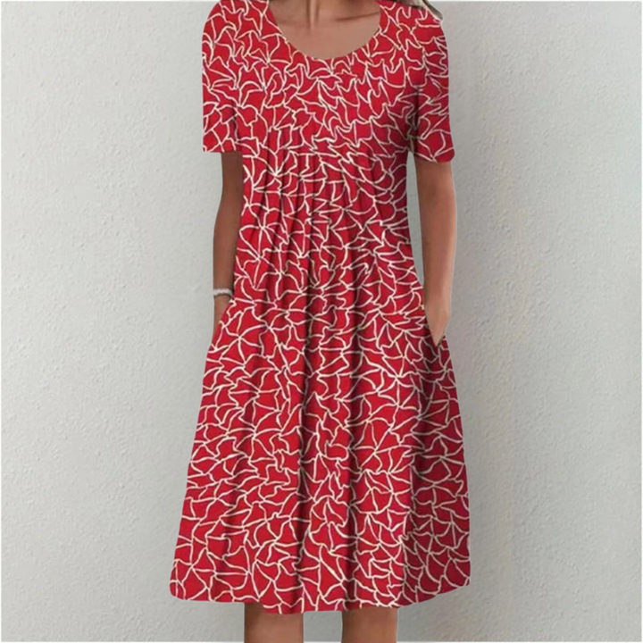 Lightweight summer floral dress for women with short sleeves and functional pockets, perfect for warm days.