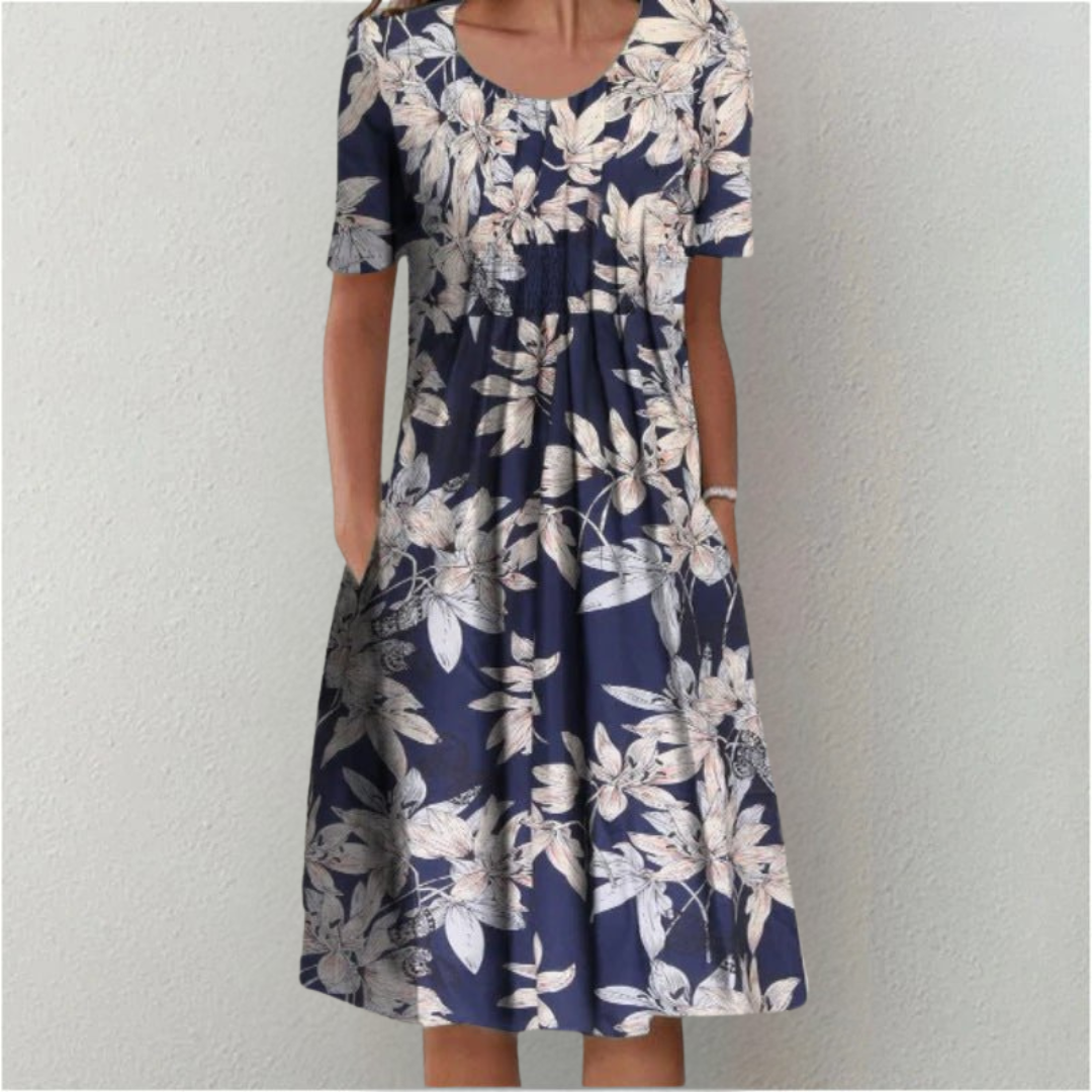 Chic A-line women's floral midi dress, designed with short sleeves & pockets for effortless casual elegance.