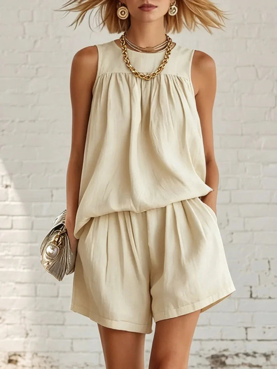 Women's casual gathered shorts two-piece set for summer fashion. Relaxed fit sleeveless top & high-waisted shorts.