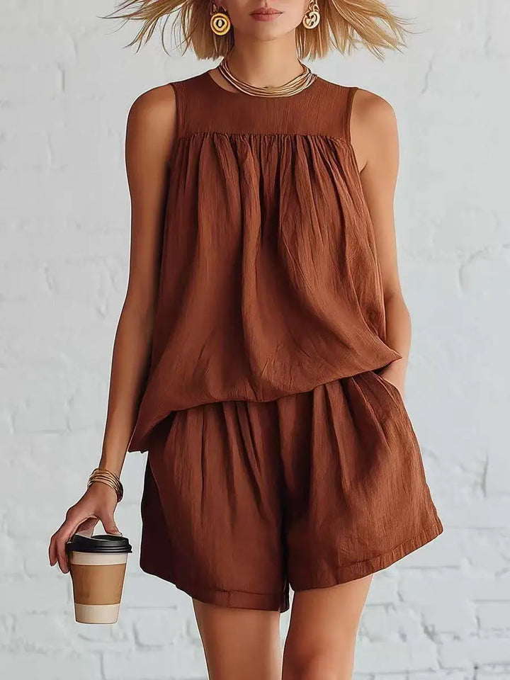 Women's summer fashion shorts set. Gathered high-waisted shorts & sleeveless top. Effortless casual two-piece outfit.