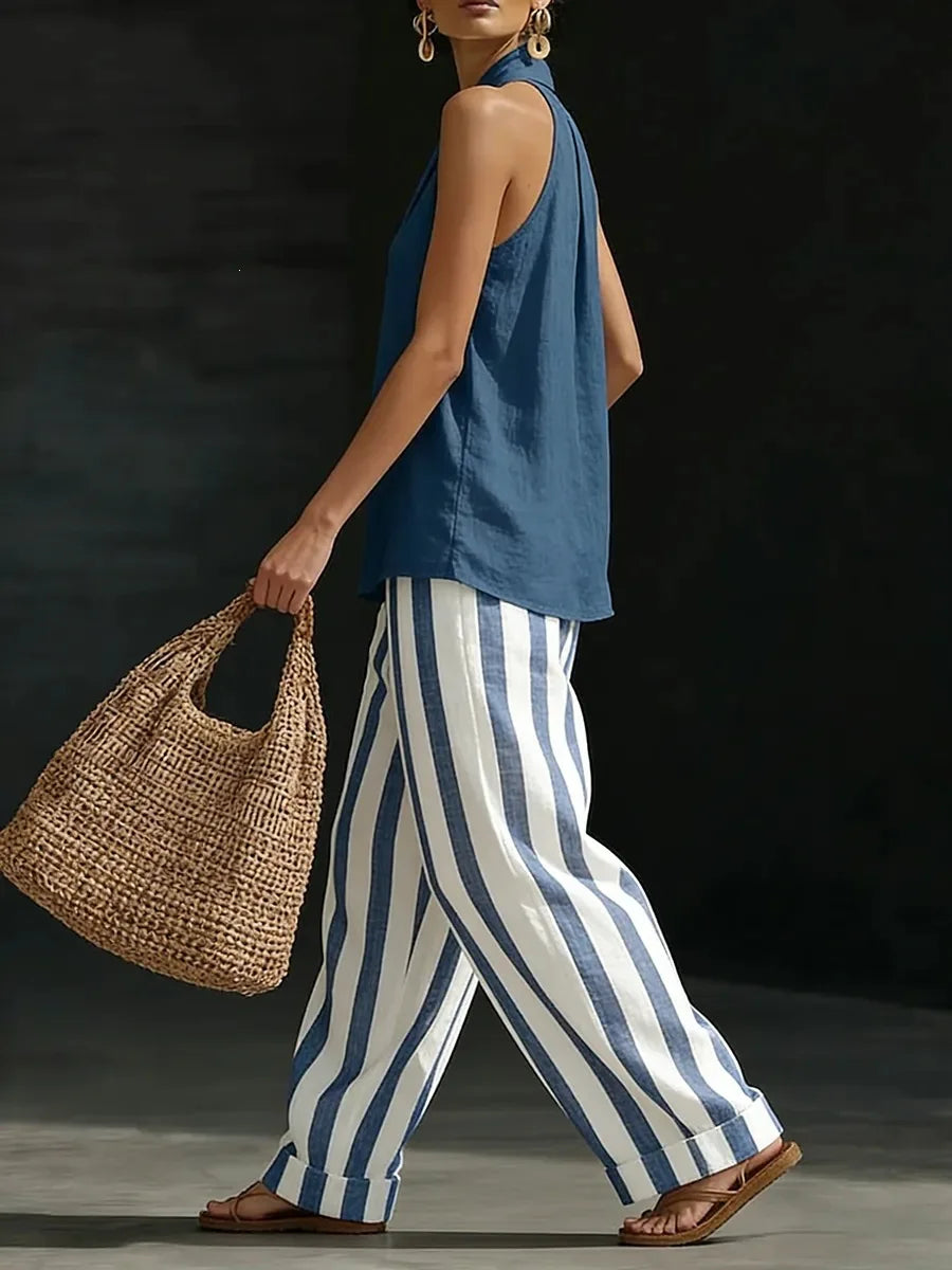 Relaxed fit women's halter top and high-waist wide leg pants set. Comfortable summer fashion outfit.