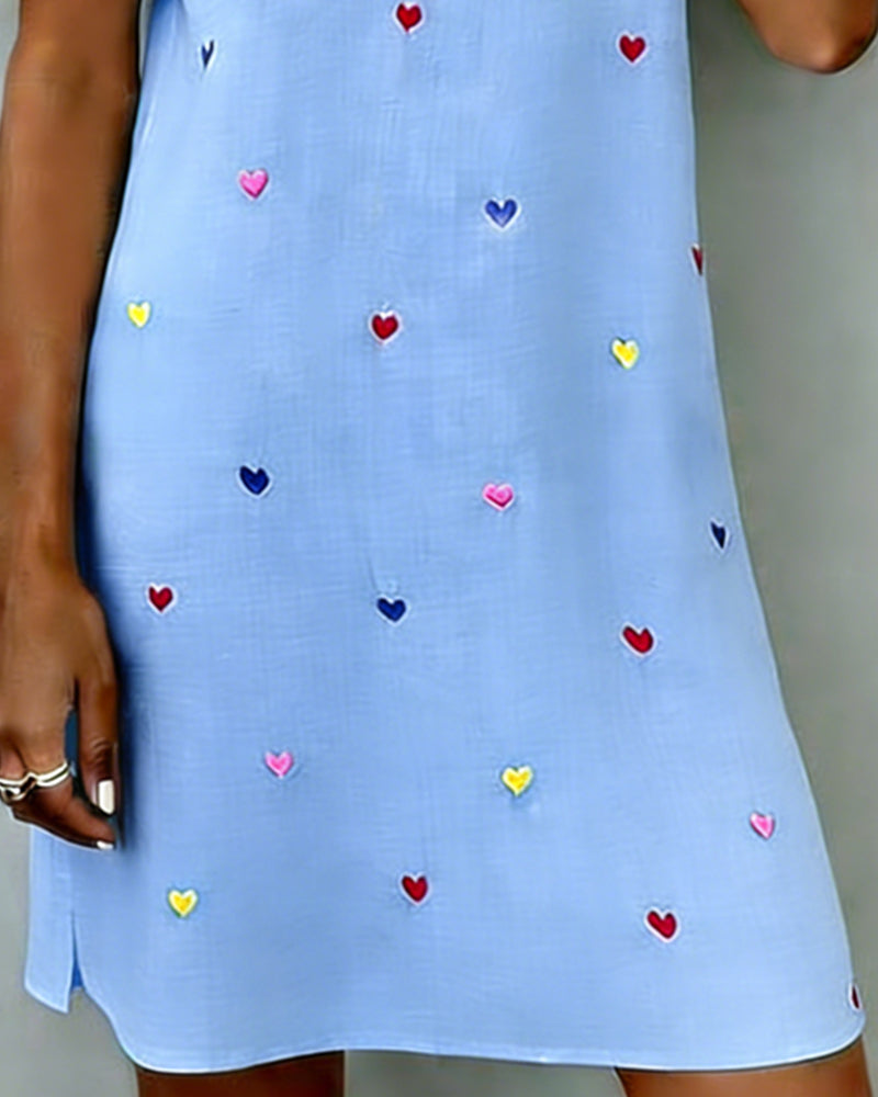 Chic women's casual dress with a charming heart print, V-neckline, and comfortable short design.