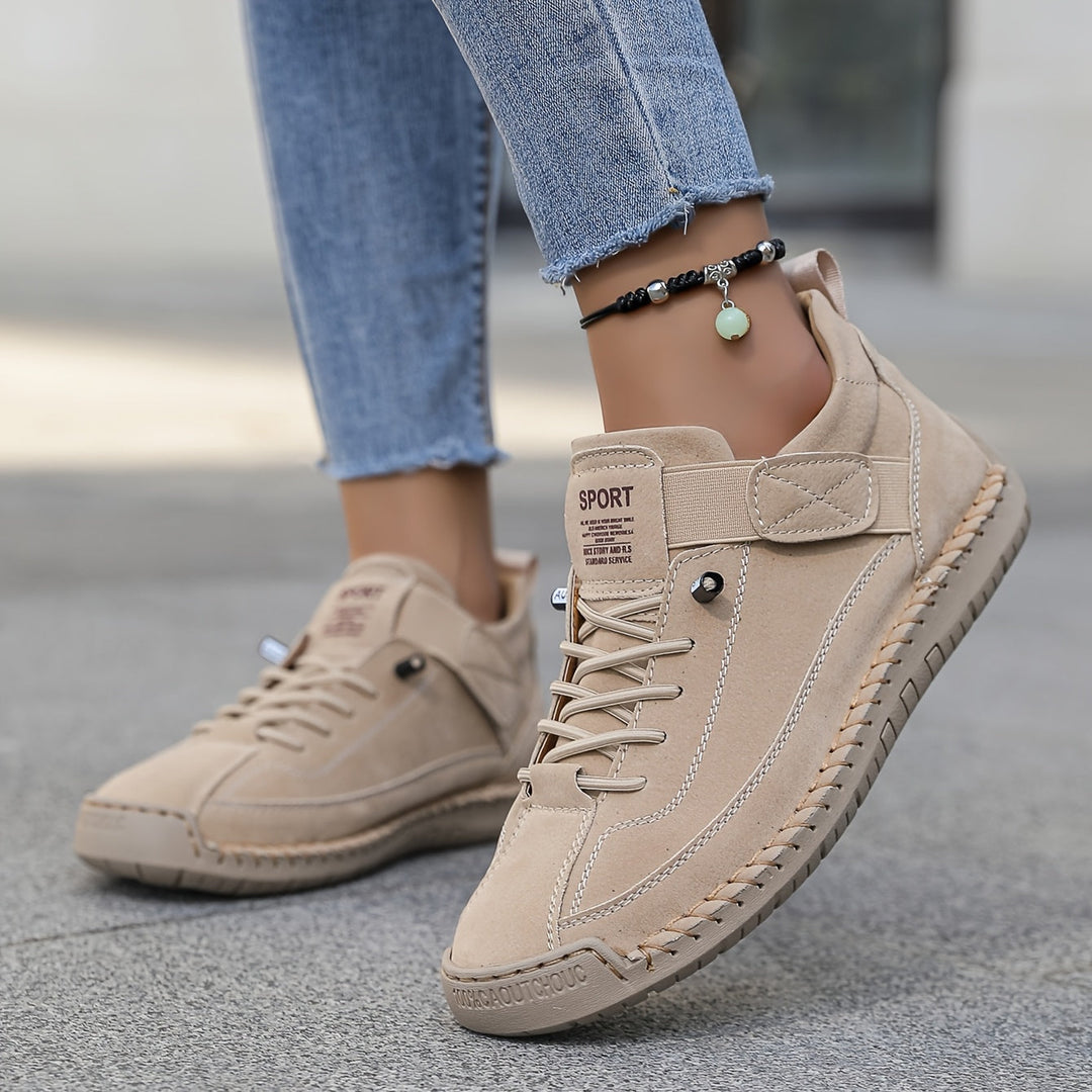 Women's casual lace-up sneakers with stitched detail. Comfortable low-top everyday walking shoes.
