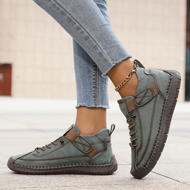 Comfortable low-top women's casual sneakers with stylish stitched details and secure lace-up closure.