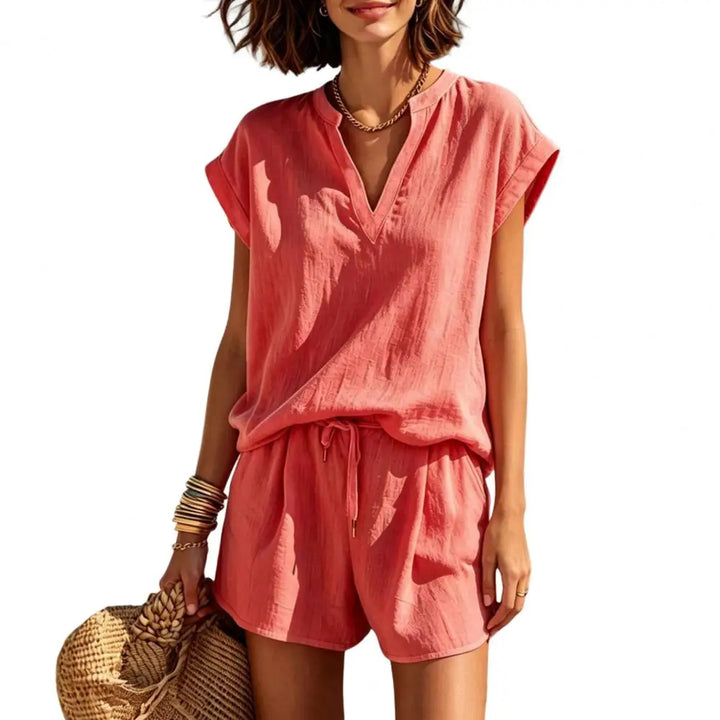 Fashionable women's linen co-ord shorts set with a V-neck top, perfect casual summer or resort outfit.