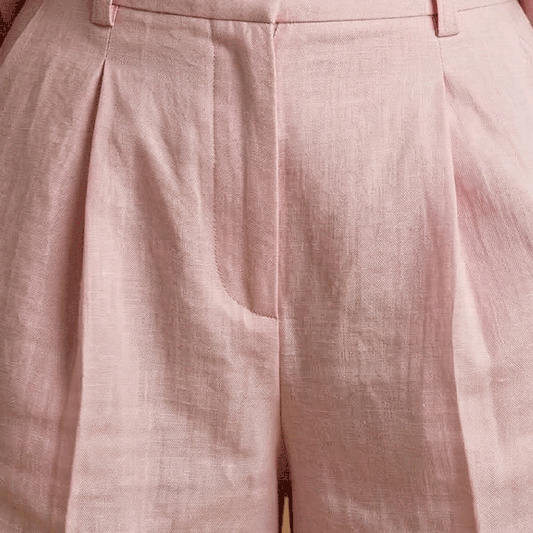 Relaxed women's long sleeve pleated shirt & shorts set. Matching casual two-piece for comfort & style.
