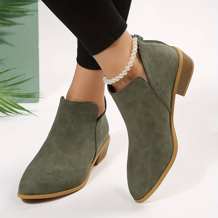 Women's casual low heel slip-on ankle boots in a versatile style for comfortable everyday wear.