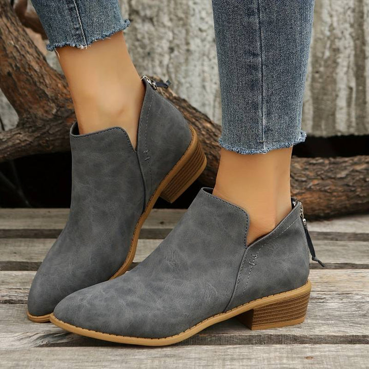 Chic women's slip-on boots with a low heel, perfect for easy wear during autumn & winter casual outings.