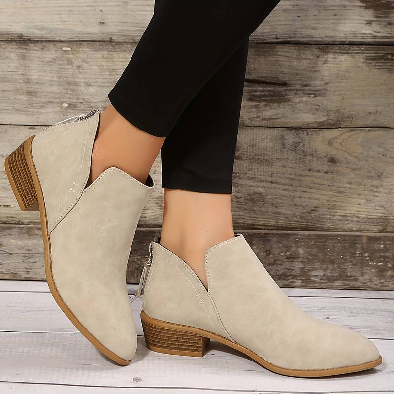 Comfortable women's fashion ankle boots; stylish low heel slip-ons for versatile and chic casual looks.