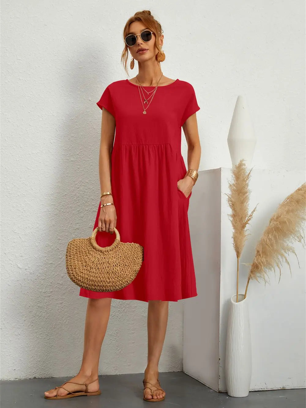 Soft fabric detail of a women's casual midi dress with short sleeves & practical pockets.