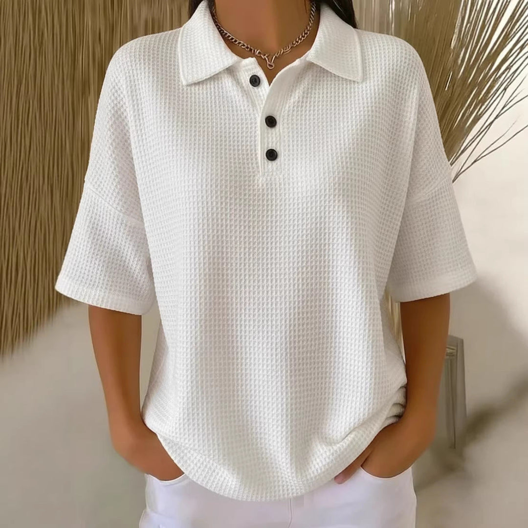 Chic women's short sleeve polo top. Loose fit for comfort, ideal for casual summer fashion.