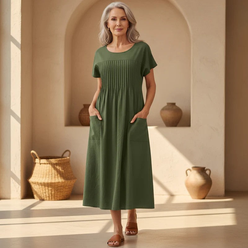 Women's casual relaxed fit midi dress with functional pockets, perfect for comfortable everyday summer wear.