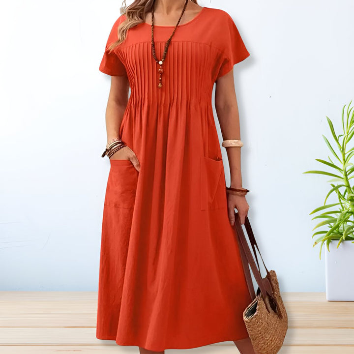 Modest women's midi dress with practical pockets, a versatile casual summer dress for everyday comfort.