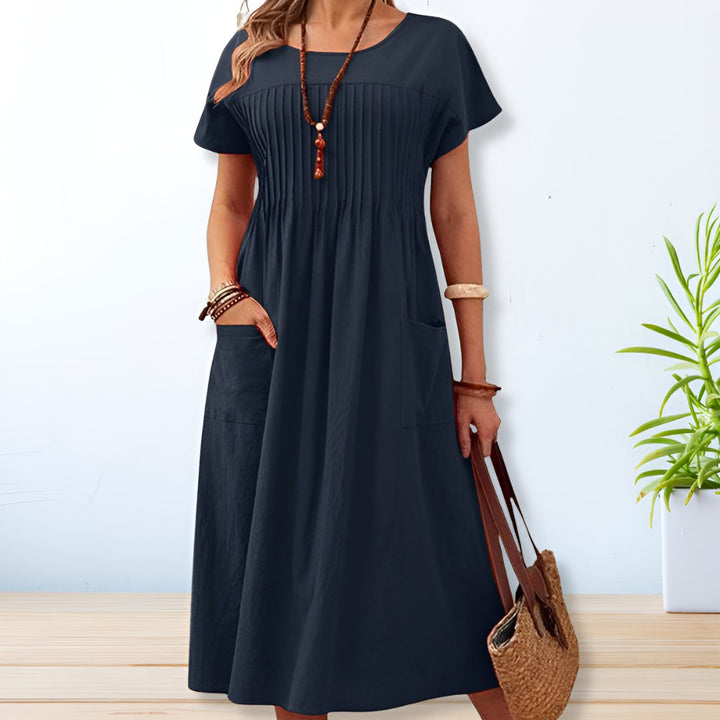 Stylish women's relaxed fit midi dress with pockets, offering ultimate comfort for everyday casual outings.