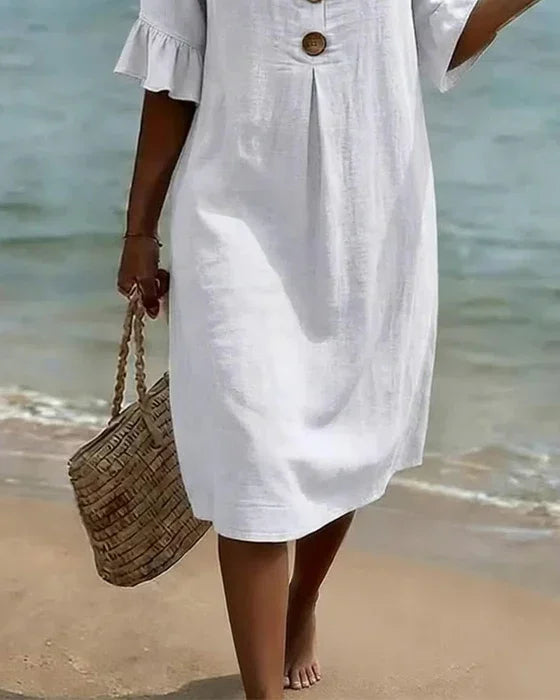 Full view of a feminine button-front ruffle sleeve midi dress. Great for casual, everyday summer and vacation wear.