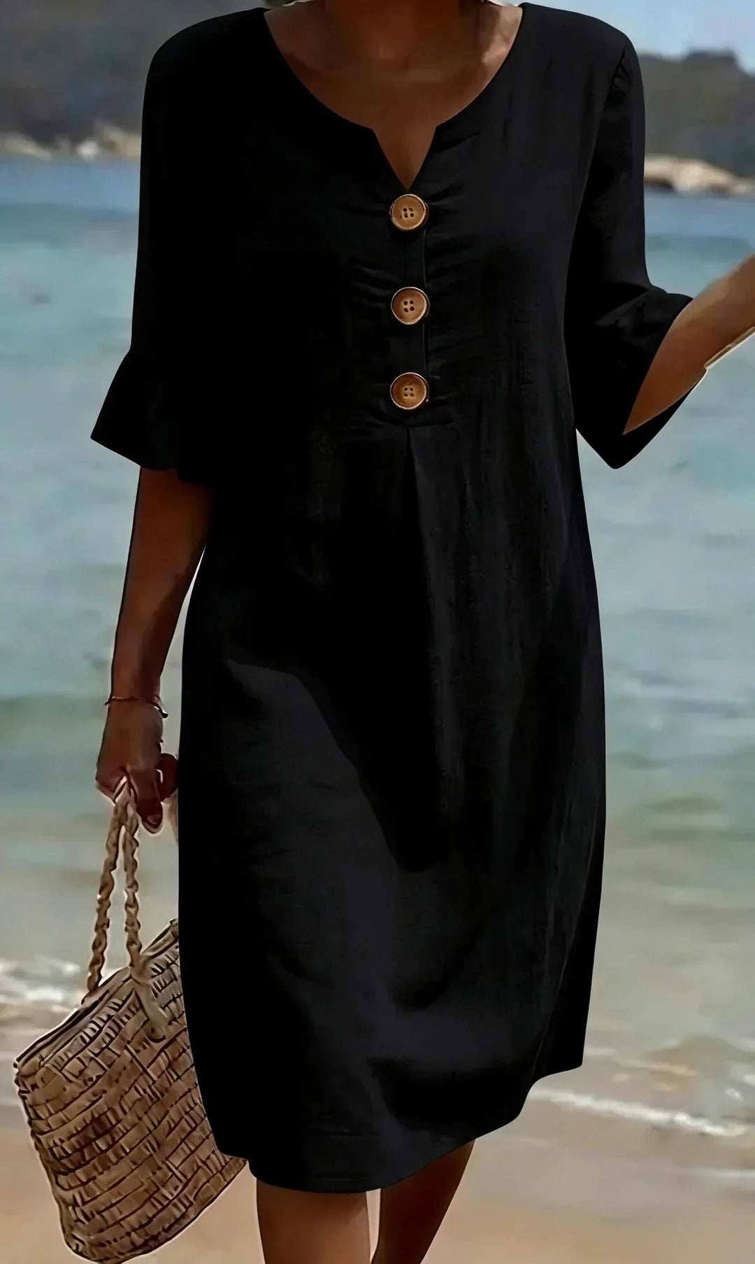 Side view of a women's flowy ruffle sleeve button-front midi dress, ideal for beach and summer holidays.
