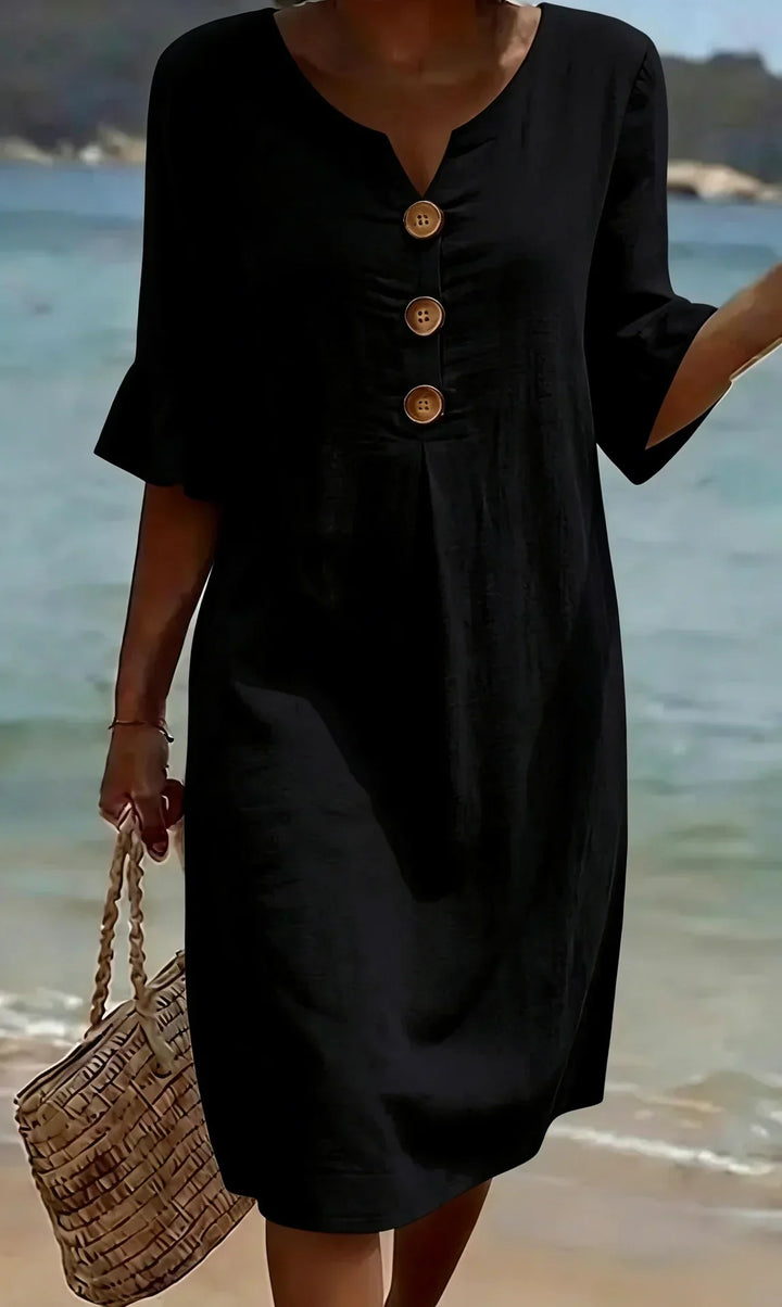 Side view of a women's flowy ruffle sleeve button-front midi dress, ideal for beach and summer holidays.