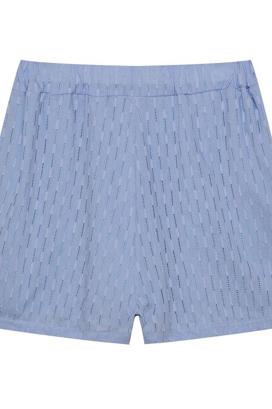 Women's spring collection shirt & short set, offering a relaxed and fashionable look.