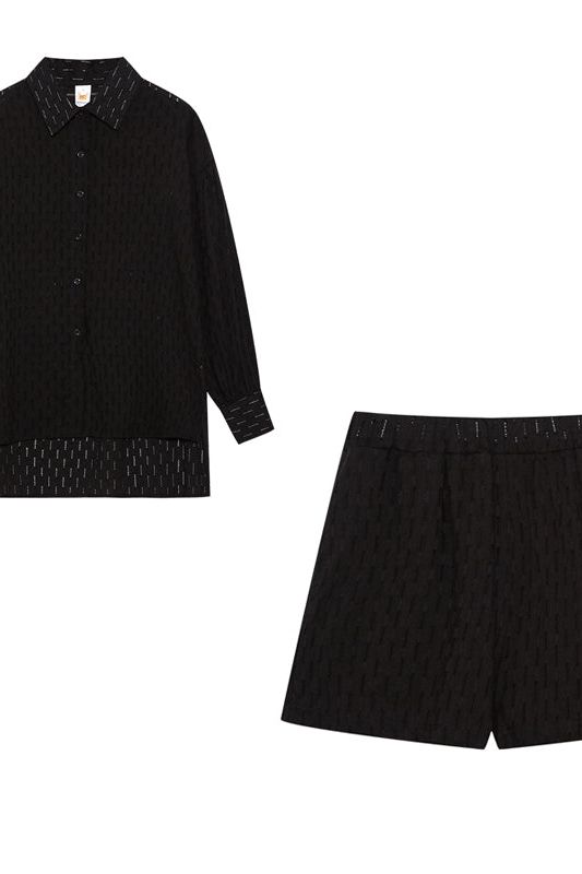 Comfortable women's two-piece casual set with stylish shirt and matching shorts.