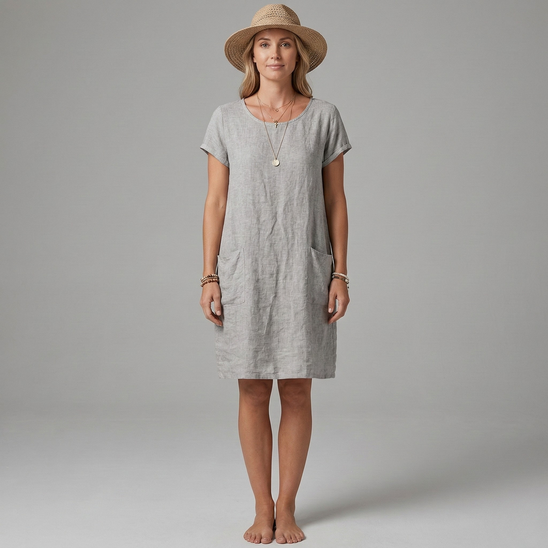 Flattering round neck mini dress for women. Short sleeves & pockets make this a practical choice for summer outings.