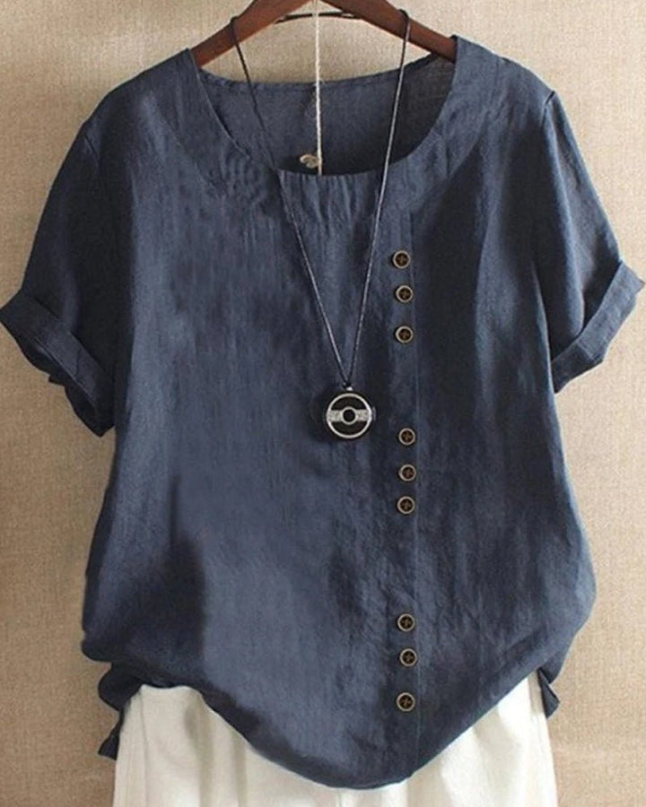 Crew neck women's short sleeve blouse with functional button front. Stylish & comfortable for casual wear.
