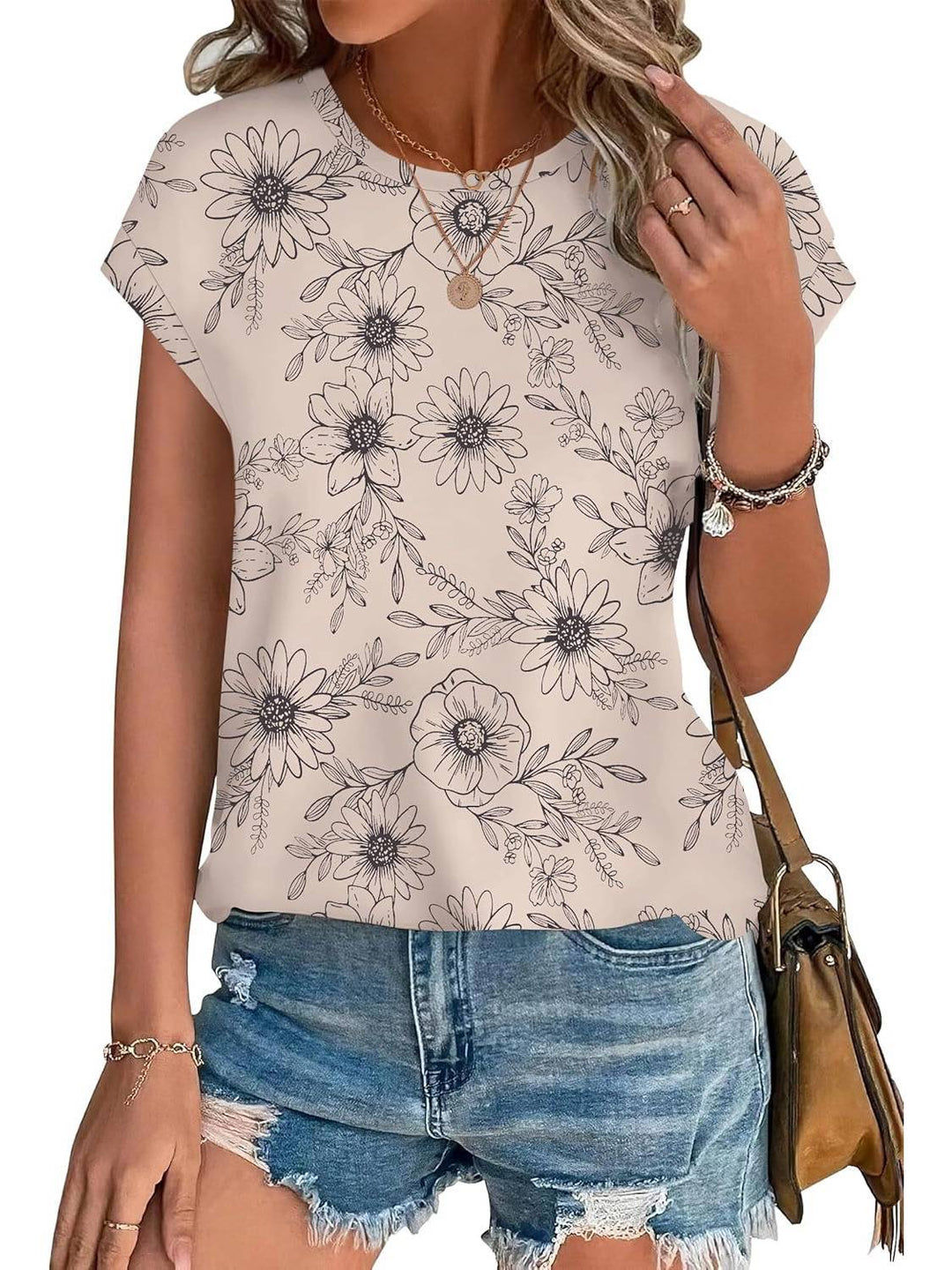 Chic women's crew neck top with a vibrant leaf print, great for spring/summer fashion.