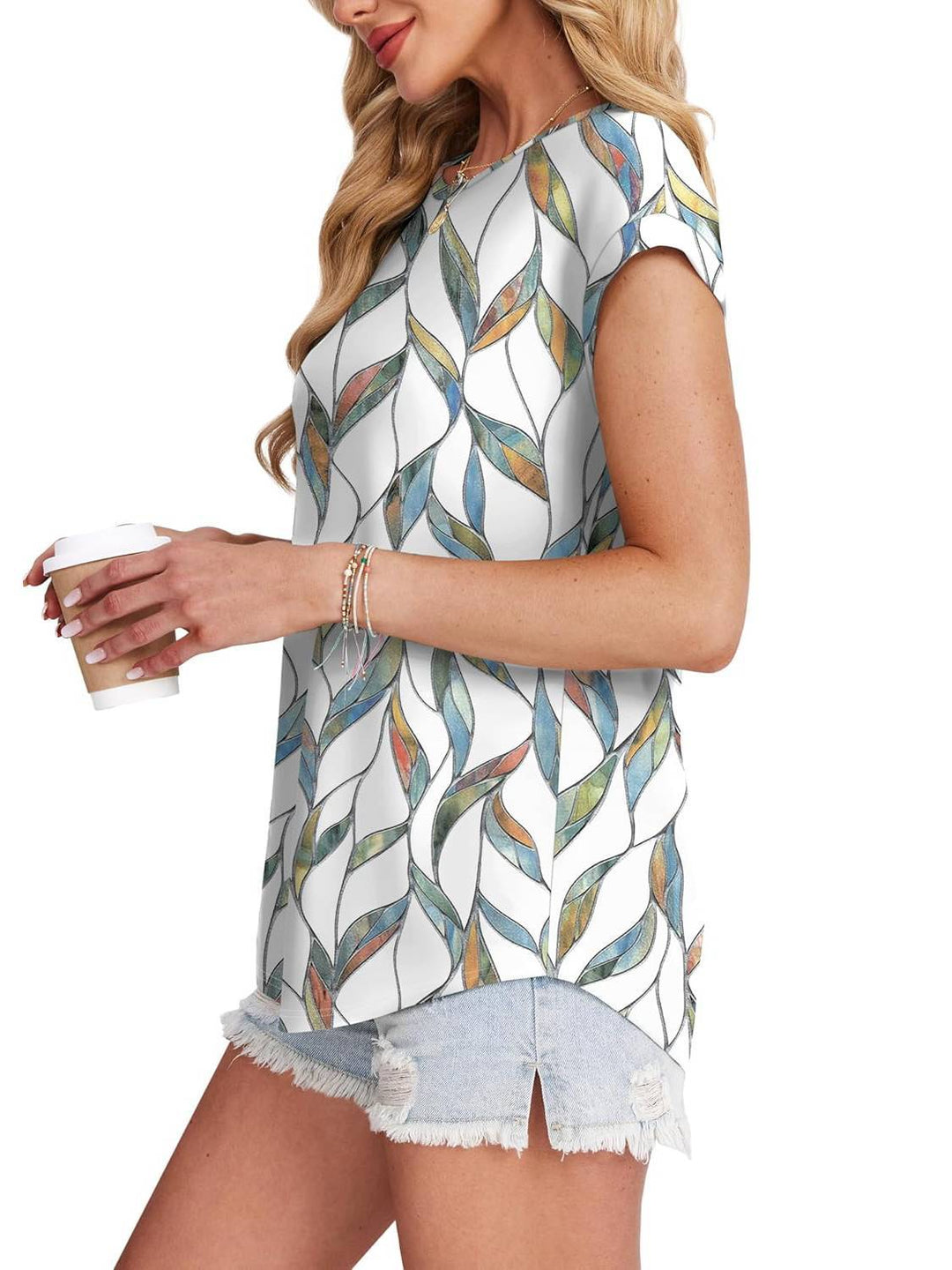 Trendy women's leaf pattern top with crew neck, perfect for relaxed casual summer outfits.
