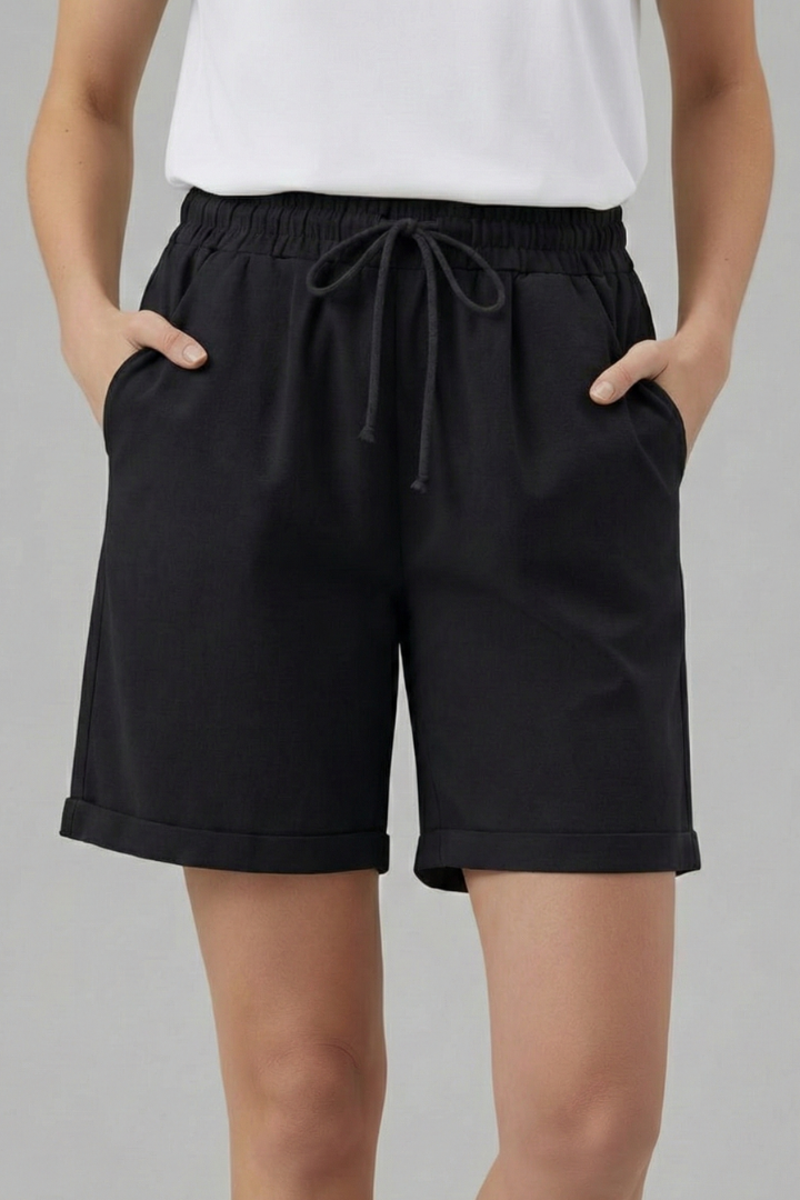 Women's relaxed fit shorts with cuffed hem and functional side pockets.