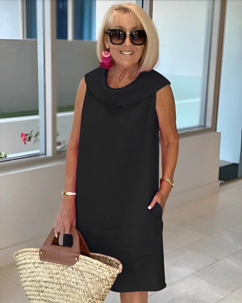Effortless women's cowl neck shift dress with pockets, a comfortable sleeveless knee-length style for everyday wear.