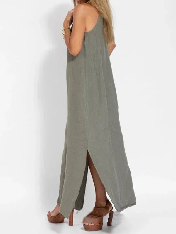 Elegant casual women's sleeveless dress with a chic side slit, ideal for beachwear & summer outings.