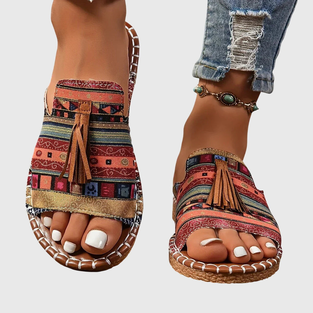 Women's casual slip-on sandals with tassel straps, perfect for summer comfort and vacation.