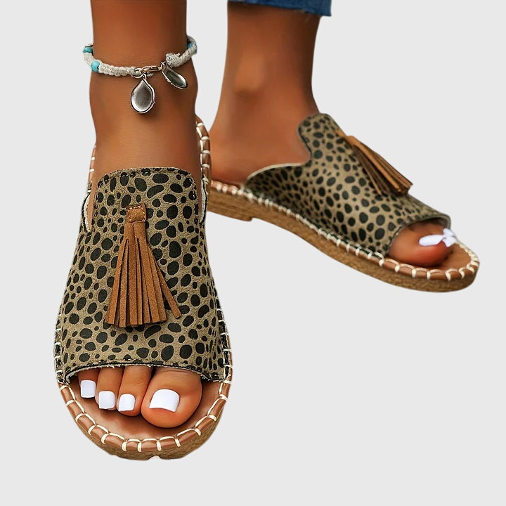 Women's summer vacation sandals, slip-on with stylish tassel straps for beach and everyday comfort.