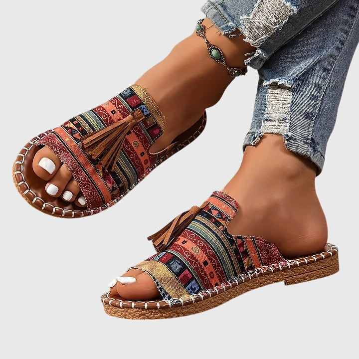 Easy-wear women's slip-on sandals with tassel straps, perfect for comfortable summer fashion.