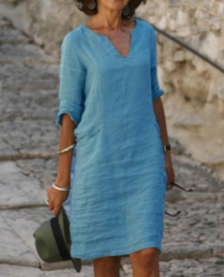 Stylish women's spring/summer casual midi dress, featuring a comfortable V-neck and relaxed fit.