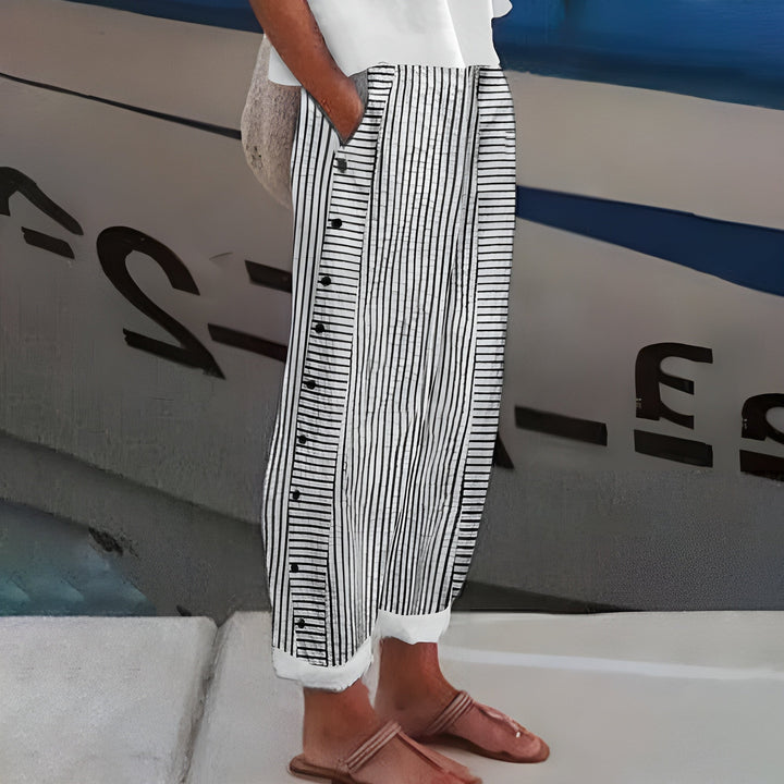 Stylish women's mid-rise straight leg cropped pants featuring a sophisticated stripe and button accents.