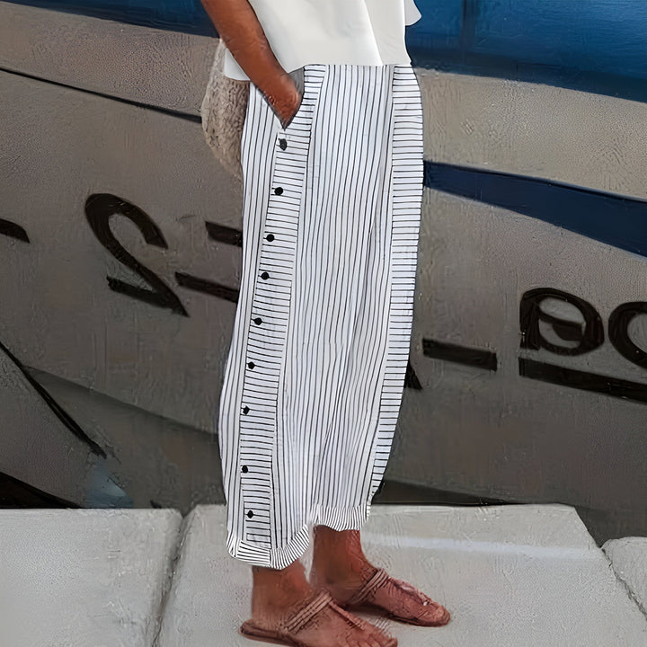 Comfortable and fashionable women's cropped trousers, featuring a modern stripe and button design for a chic summer look.