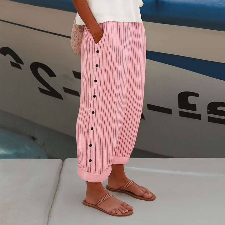 Versatile women's cropped pants with elegant stripe and button details, ideal for smart casual or everyday fashion.