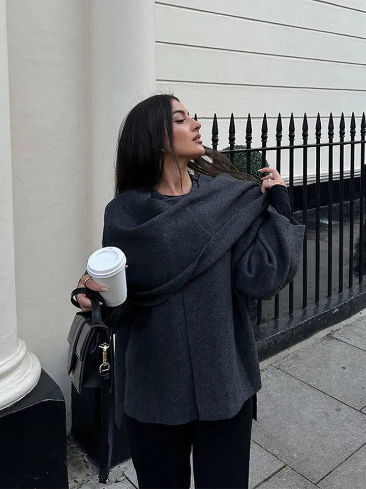 Grey women's drape cape coat, viewed from behind, highlighting its effortless drape and elegant loose fit.