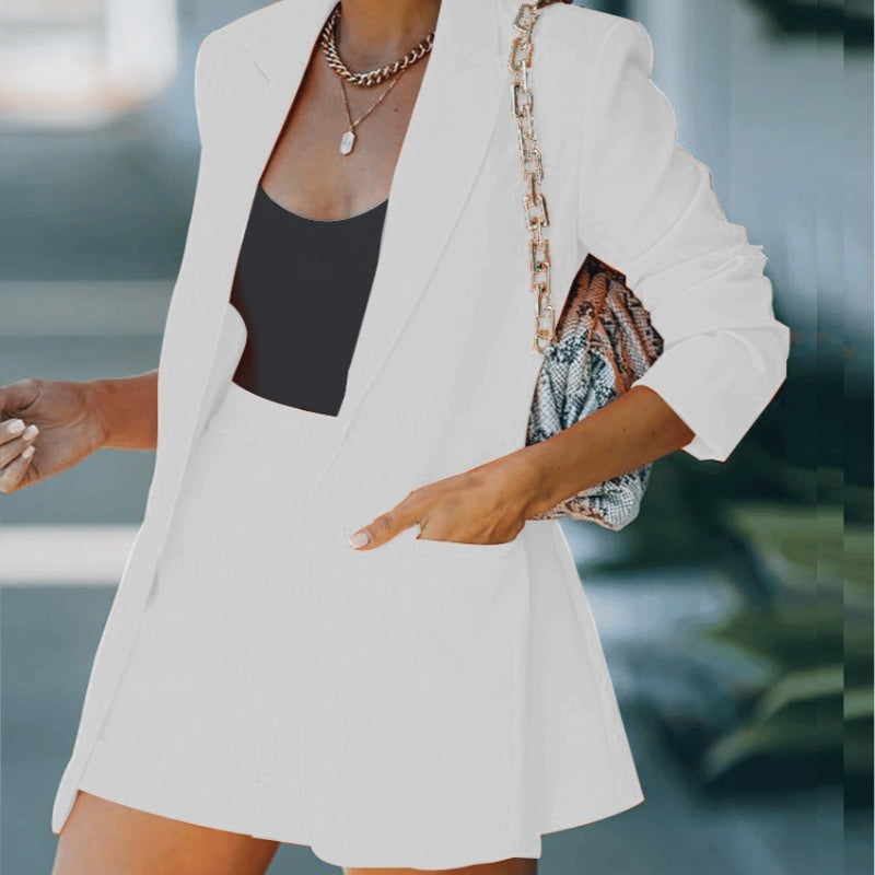 Elegant white women's blazer and shorts set. A versatile two-piece co-ord, ideal for a chic summer outfit.