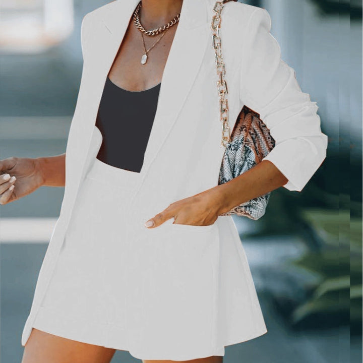 Elegant white women's blazer and shorts set. A versatile two-piece co-ord, ideal for a chic summer outfit.