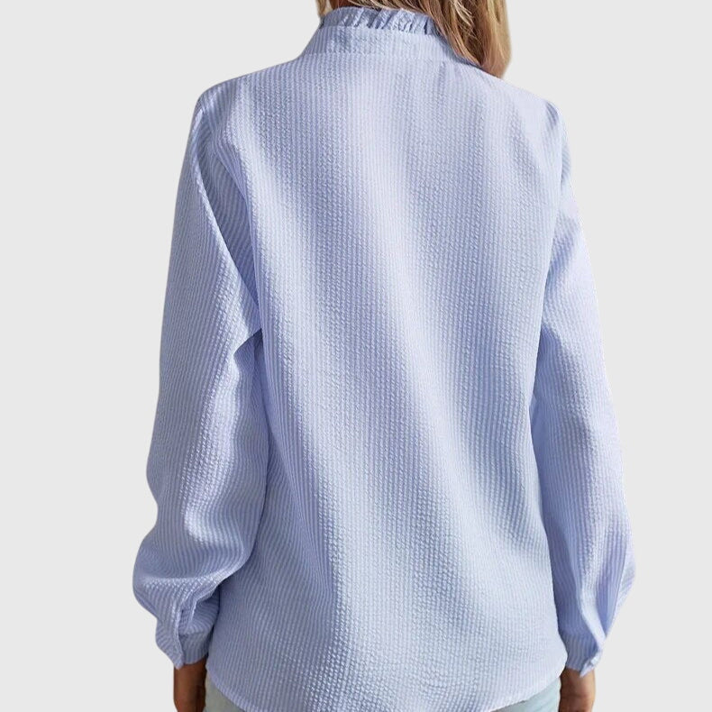 Elegant long-sleeve women's blouse, a stylish top perfect for spring fashion and professional office wear.