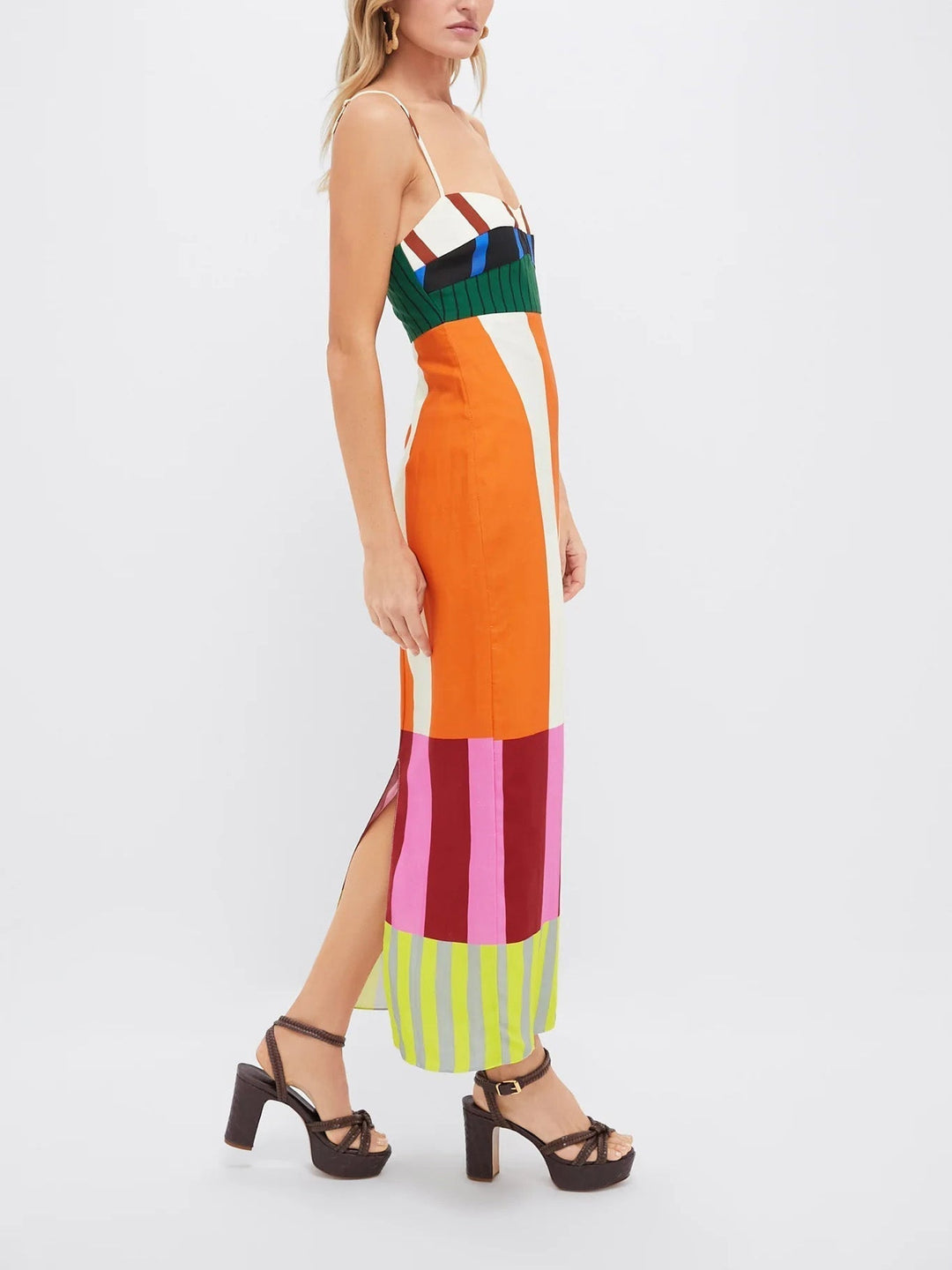 Women's sleek bodycon midi dress with bold stripes. Spaghetti strap sleeveless design for a modern statement.