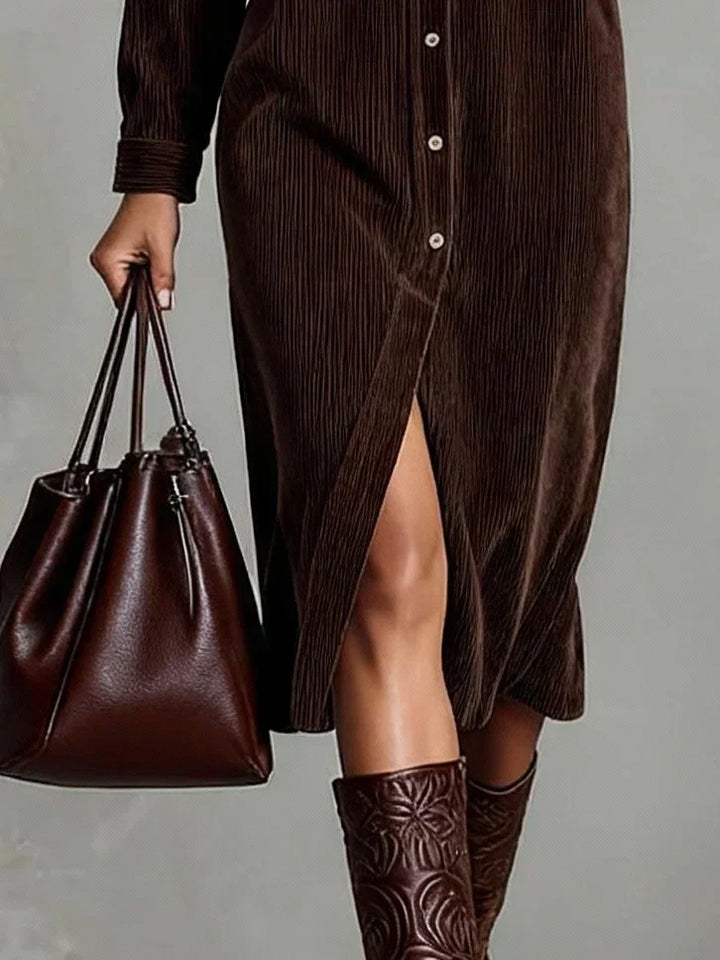 Close-up of the button-down front on a chic women's long sleeve shirt dress with dual pockets, fall fashion.